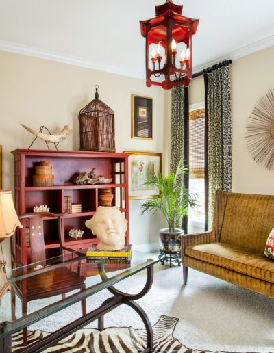 A living room with a zebra print rug.