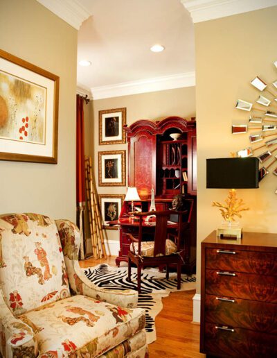 A living room with a chair and a desk.